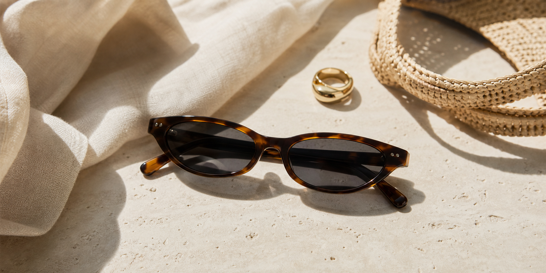 Editorial hero image for the best sunglasses for small faces guide by By Our Bias, featuring narrow-fit sunglasses in a modern styled setting